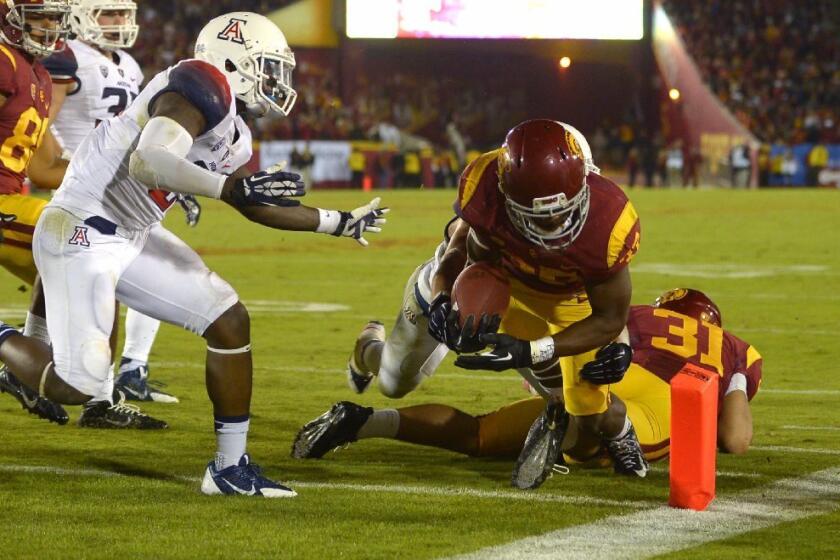 Javorius Allen dives in for a touchdown during USC's win over Arizona.