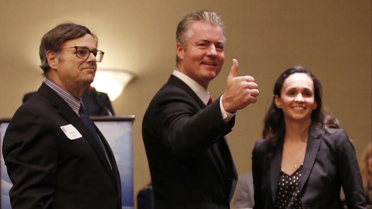 Steve Frank, left, Travis Allen and Jessica Patterson, candidates for chair of the California Republican Party, attend a meeting of Orange County Republicans in January.