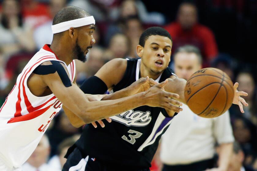 Ray McCallum Jr. (3) chases after a loose ball while a member of the Sacramento Kings against Rockets forward Corey Brewer. The California native has since played in China.