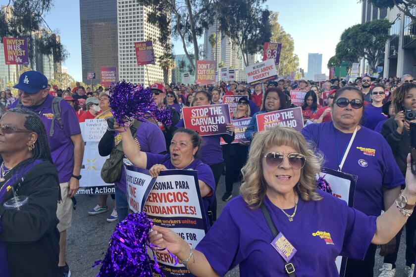 Thousands of participants cheer on speakers in a May 7 rally to oppose anticipated budget cuts outside the headquarters of the Los Angeles Unified School District, just west of downtown L.A.