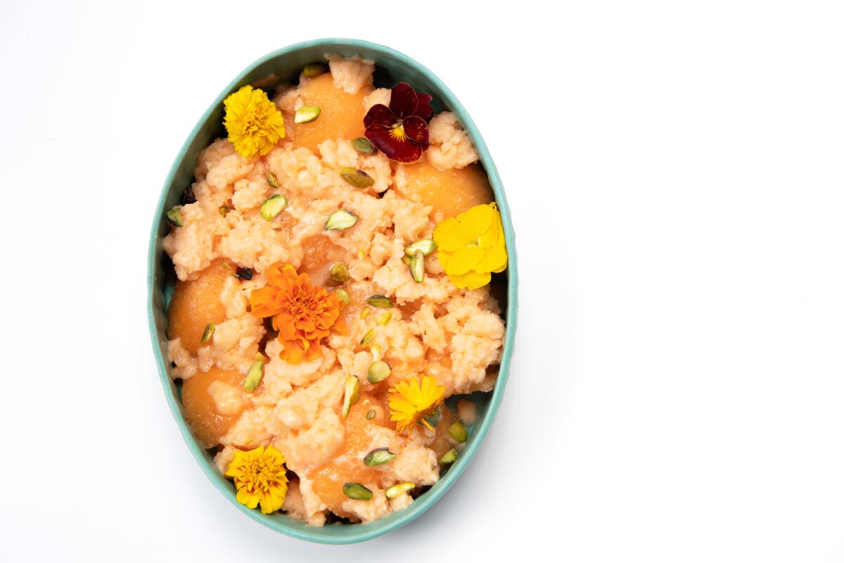 Ripe melons are made into a rosewater-tinged granita, then served over more melons with pistachios and edible flowers.