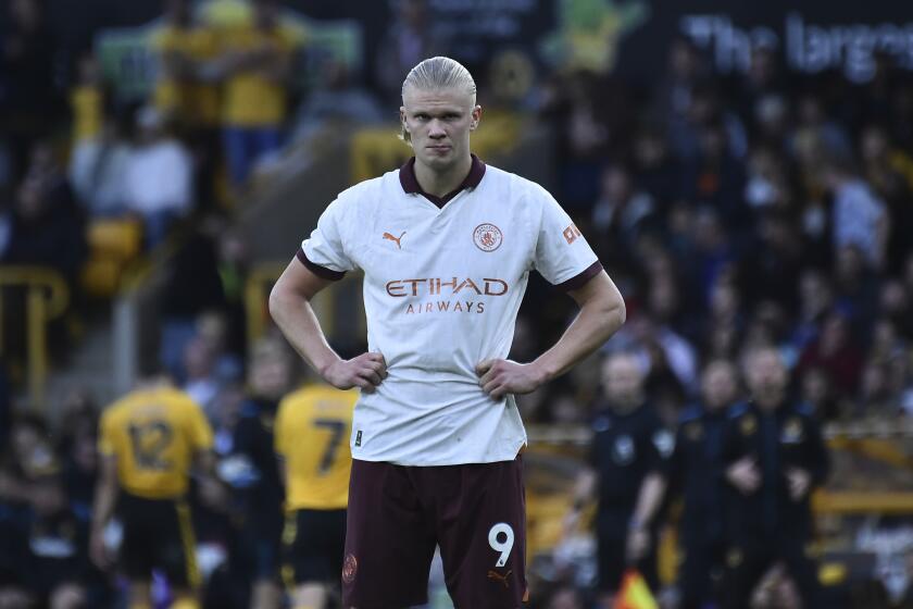 Manchester City's Erling Haaland gestures during the English Premier League soccer match between Wolverhampton Wanderers and Manchester City at the Molineux Stadium in Wolverhampton, England, Saturday, Sept. 30, 2023. (AP Photo/Rui Vieira)