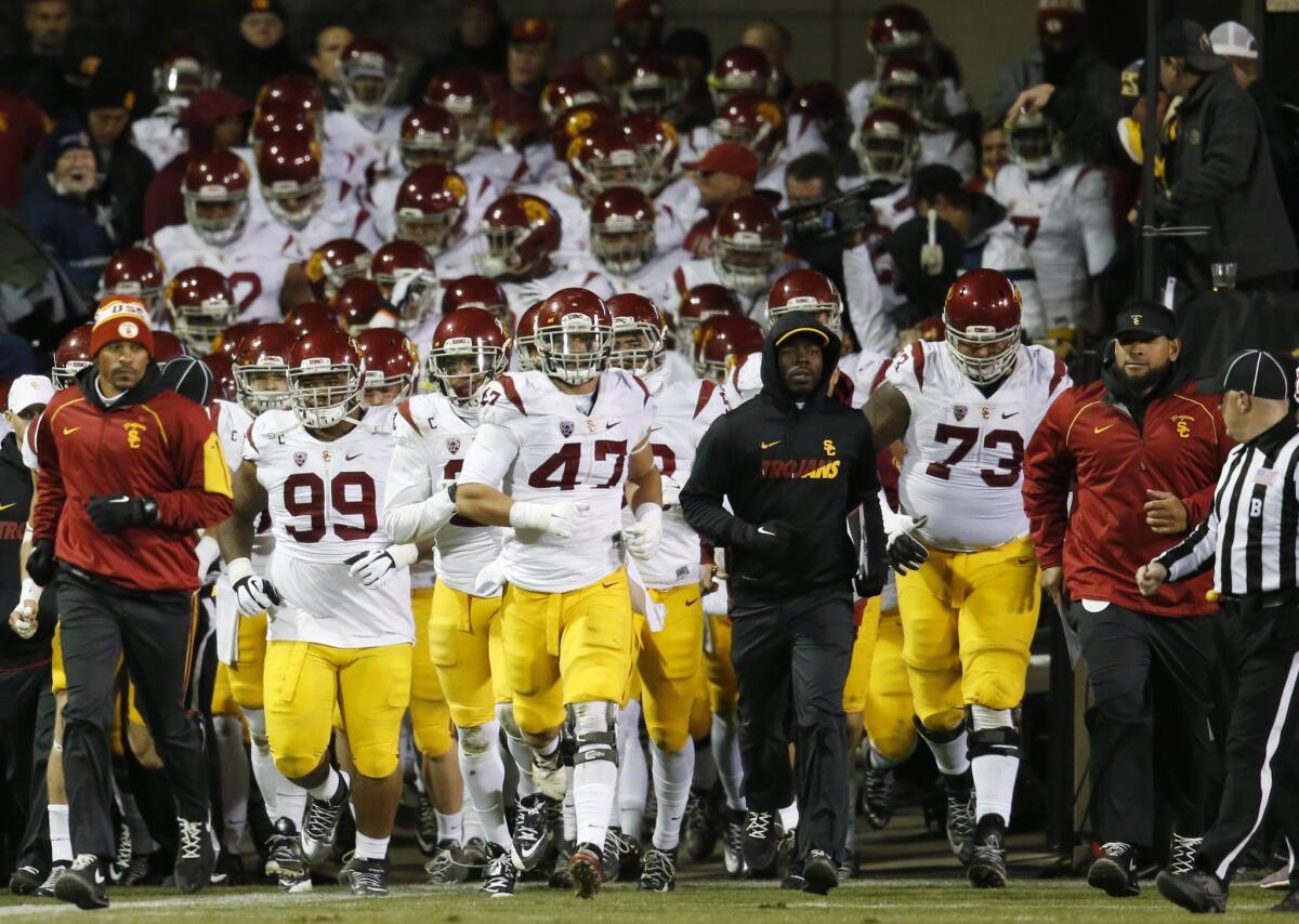 USC players take the field against Colorado on Nov. 13.