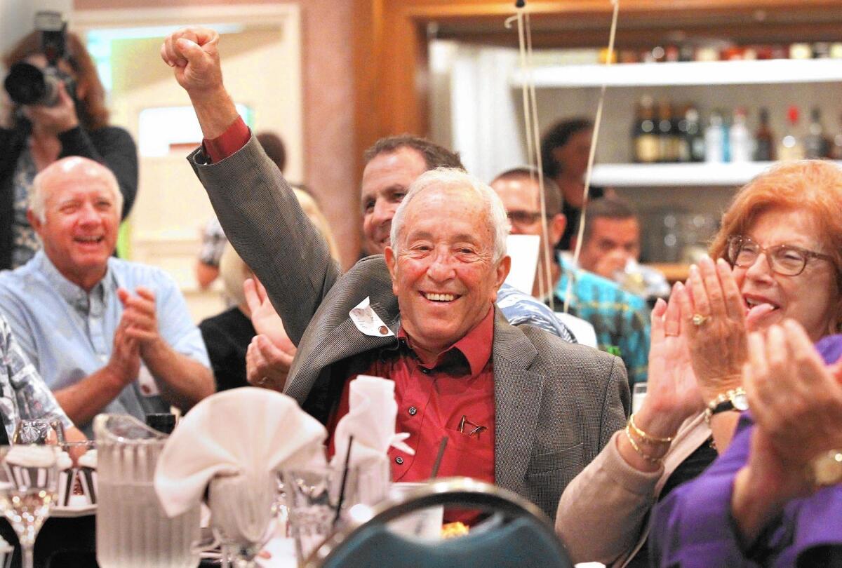 Fran Ursini is announced to the room at his roast and toast celebration to honor his 50th and final year of working as a high school football referee.