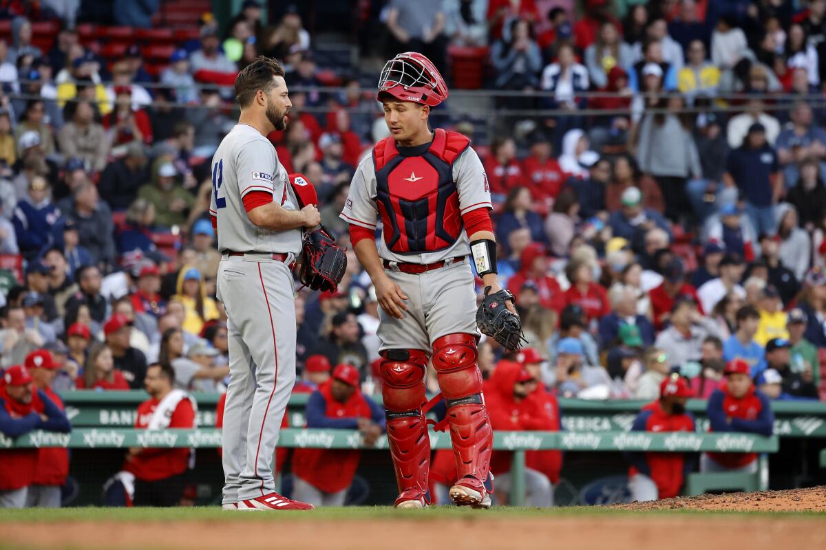 Angels pitcher Ryan Tepera talks with Matt Thaiss during an eighth-inning review of catcher's interference.