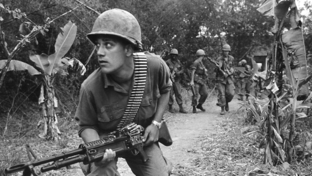 A paratrooper of the U.S. 82nd Airborne Brigade advances near Hue, South Vietnam on April 3, 1968.