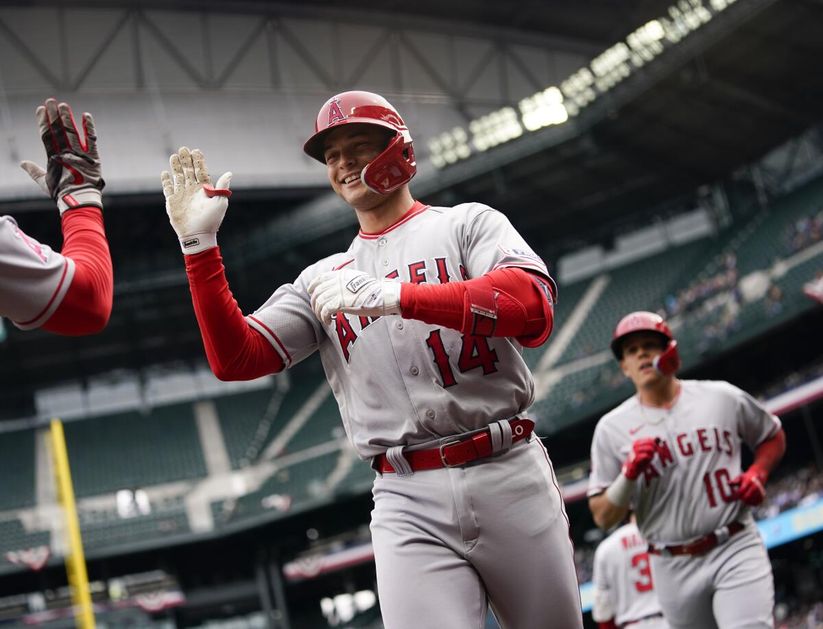 Los Angeles Angels' Logan O'Hoppe greets teammates after hitting a two-run home run against the Seattle Mariners April 5.