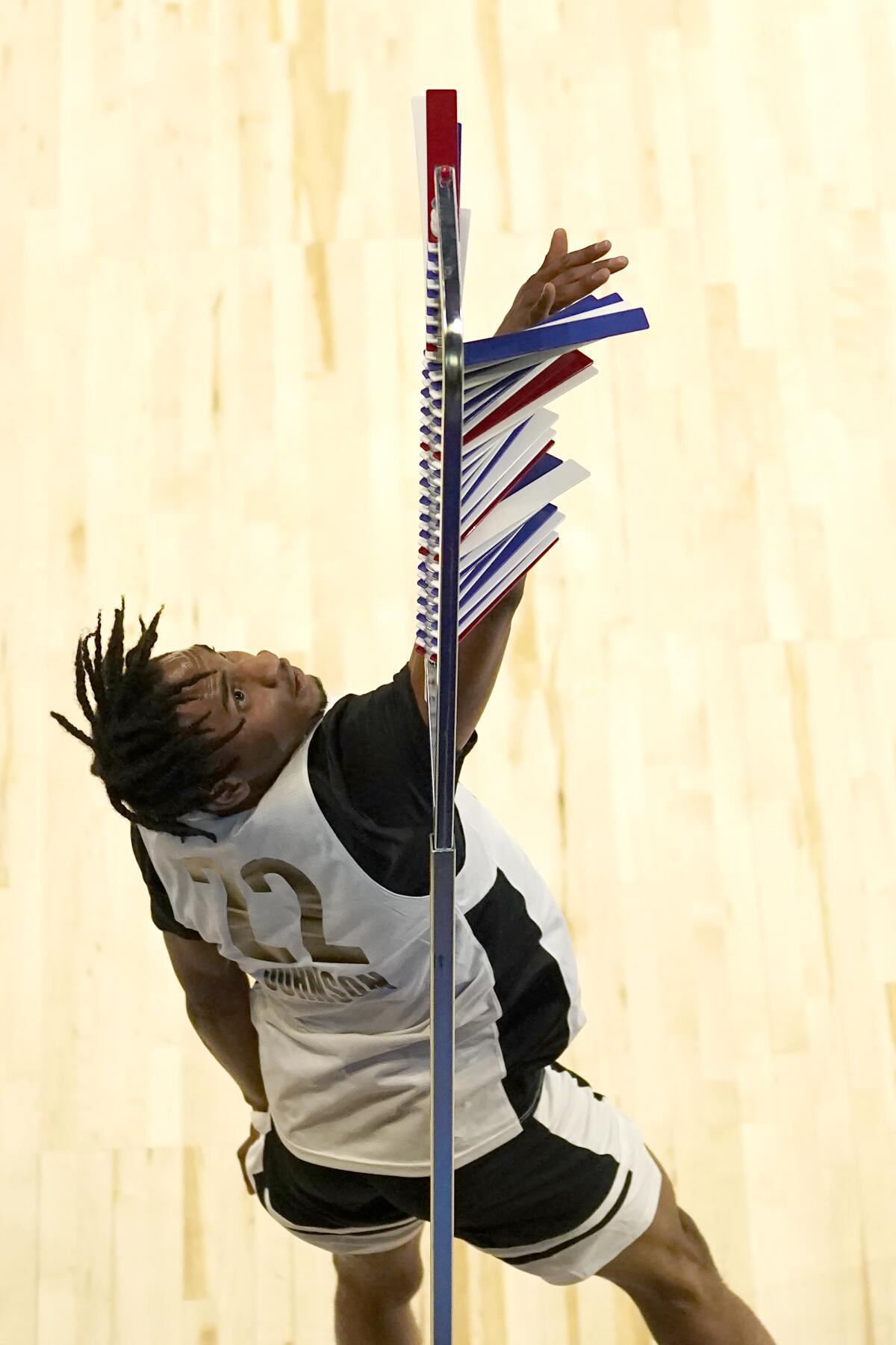 Keon Johnson participates in vertical leap at the NBA draft combine.
