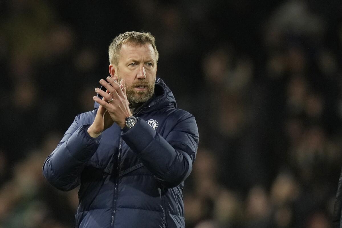 Chelsea's head coach Graham Potter applauds after the English Premier League soccer match between Fulham and Chelsea at the Craven Cottage stadium in London Thursday, Jan. 12, 2023. (AP Photo/Alastair Grant)
