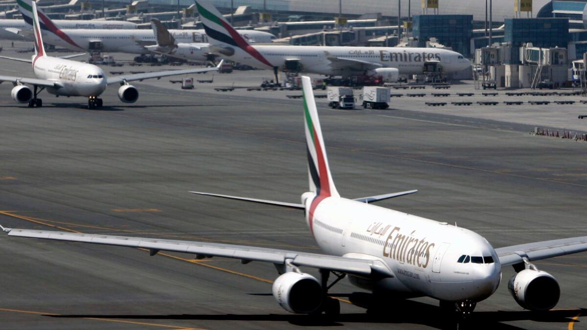 Emirates jets taxi at Dubai International Airport in the United Arab Emirates. The carrier responded to an electronics ban by letting passengers use their laptops and tablet devices on the first leg of their trip before leaving for the U.S. from Dubai.