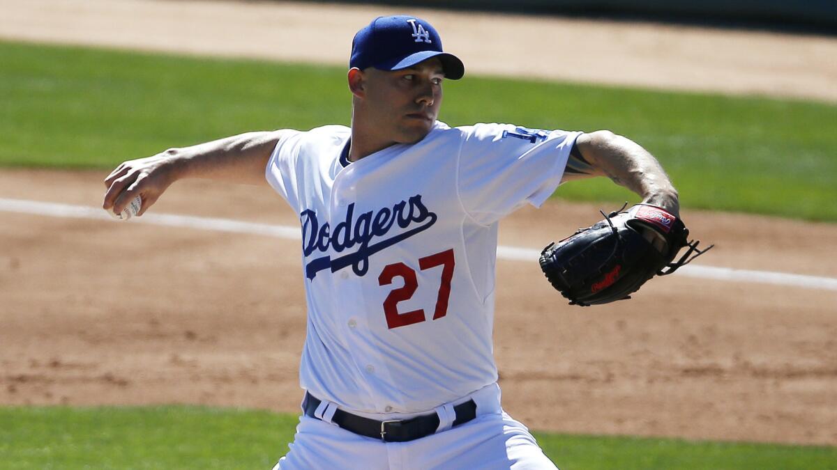 Dodgers reliever Dustin McGowan pitches during an exhibition game against the Seattle Mariners on March 6.