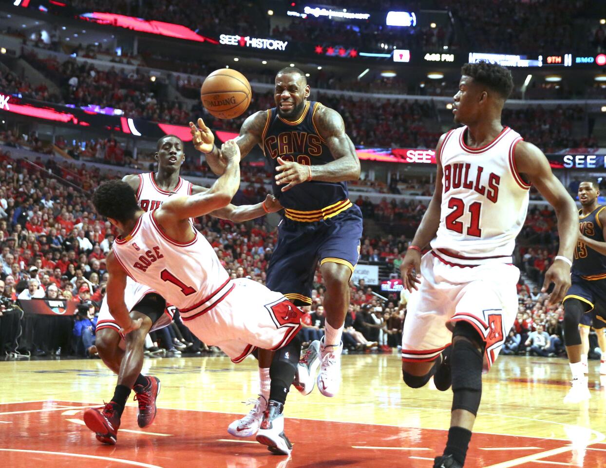 Derrick Rose stops LeBron James on his way to the basket during the second half.