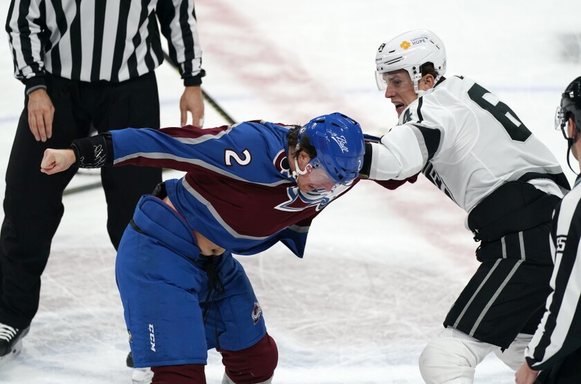 Colorado Avalanche defenseman Dan Renouf, left, and Los Angeles Kings right wing Matt Luff fight during the second period of an NHL hockey game Friday, March 12, 2021, in Denver. (AP Photo/David Zalubowski)