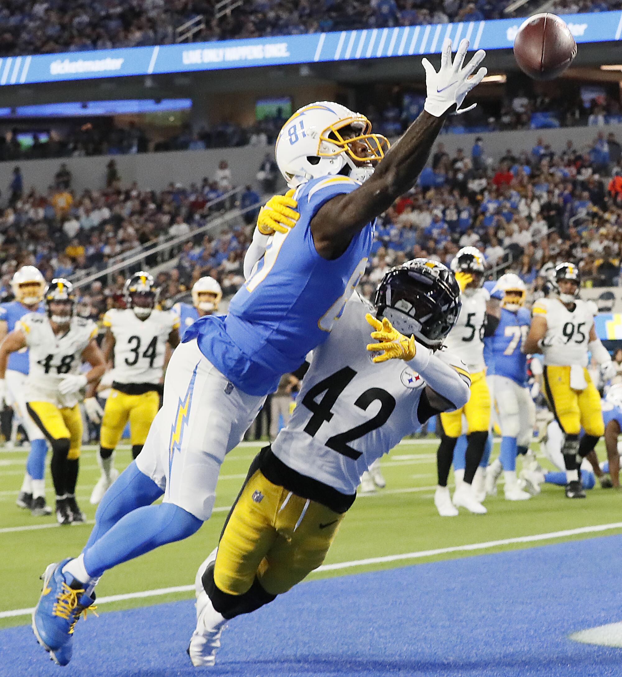 Chargers receiver Mike Williams can't haul in a touchdown pass while under pressure from Steelers cornerback James Pierre.