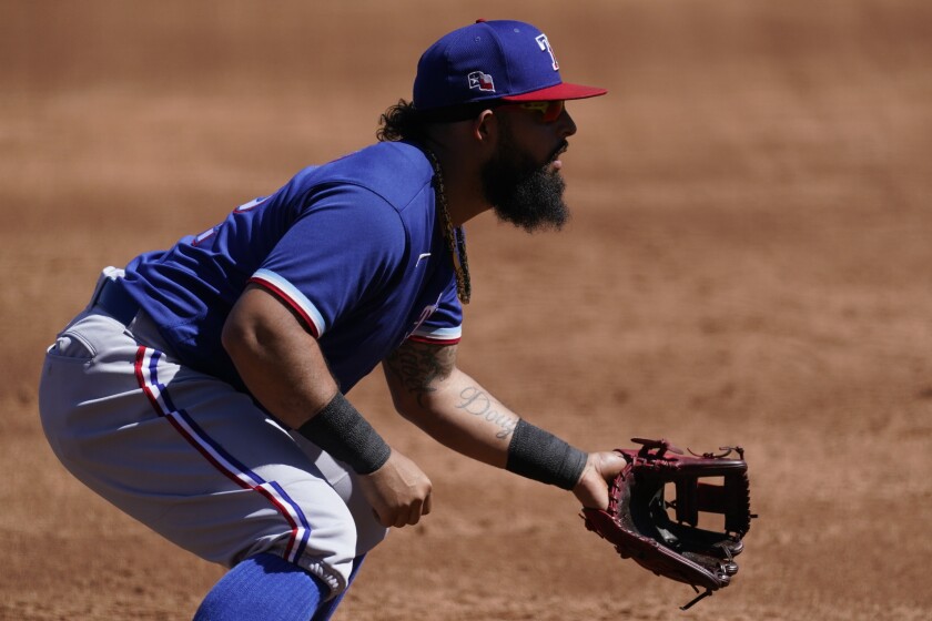 Texas Rangers second baseman Rougned Odor (12) stands at the ready during the third inning of a spring training baseball game against the Colorado Rockies Monday, March 22, 2021, in Scottsdale, Ariz. (AP Photo/Ashley Landis)