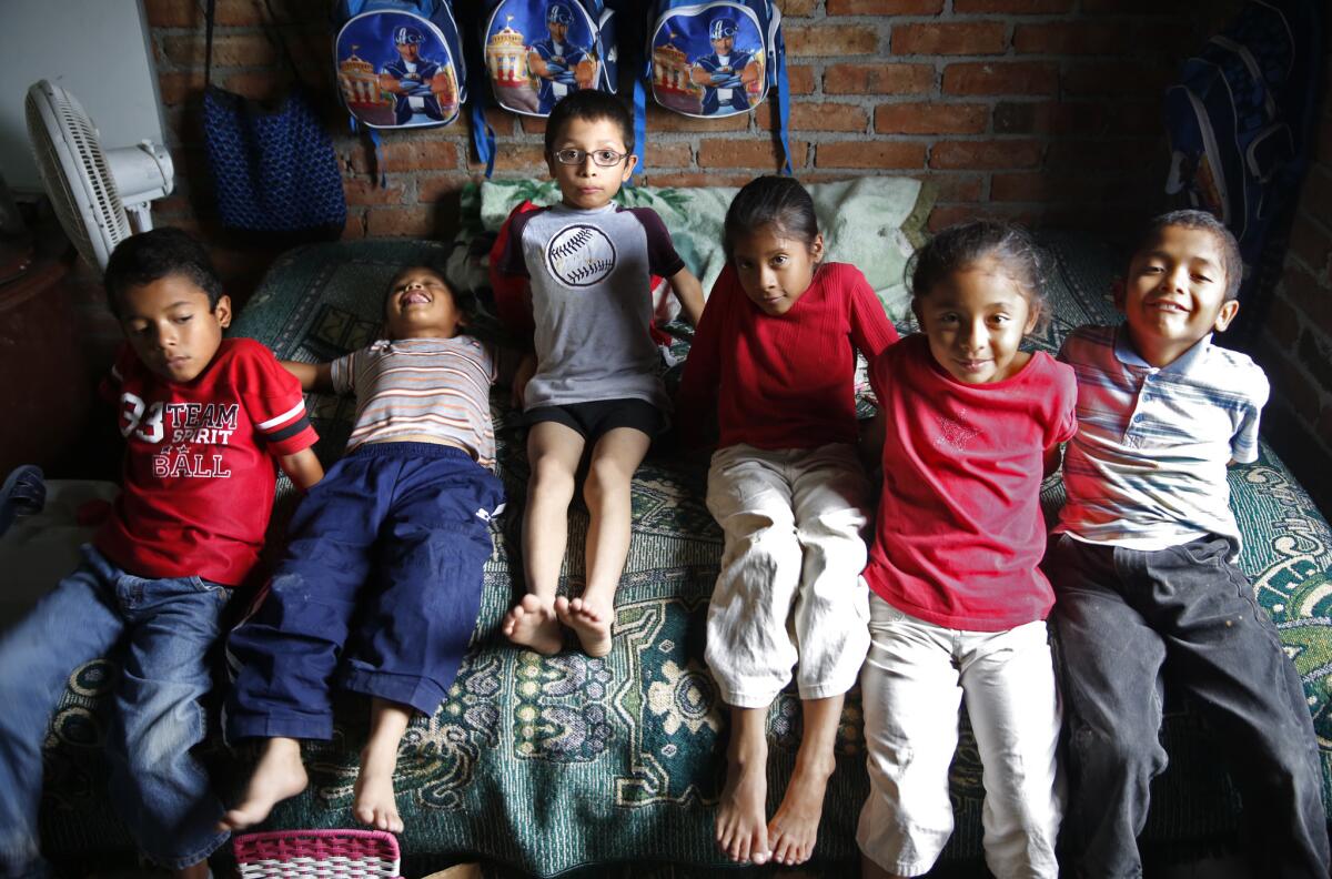 The 8-year-old Ireta sextuplets -- Noe, Carlos, Omar, Maria, Teresa, and Marcos -- in their home near Irapuato, Mexico. They were born in San Diego to undocumented Mexican parents Benigno and Gabriela Ireta.