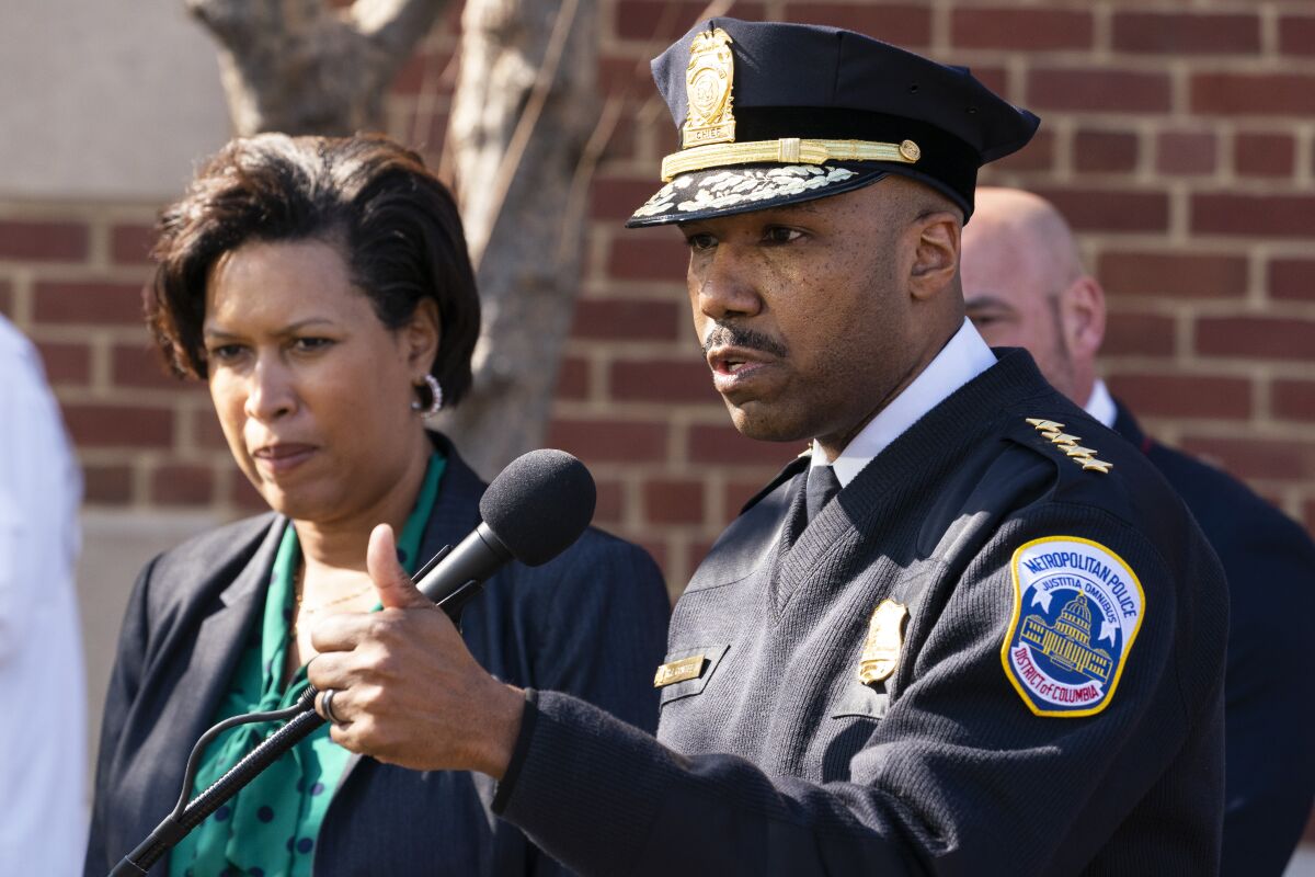 Washington Mayor Muriel Bowser, left, and Washington Metropolitan Police Chief Robert Contee III, speak during a news conference about the arrest of suspect in a recent string of attacks on homeless people, Tuesday, March 15, 2022, in Washington. A gunman suspected of stalking homeless people asleep on the streets of New York City and Washington, killing at least two people and wounding three others, was arrested early Tuesday, police said. (AP Photo/Alex Brandon)