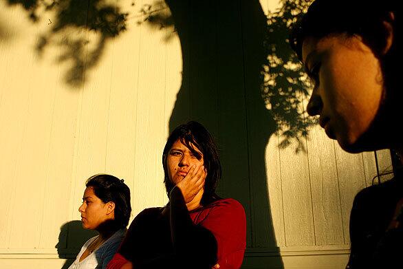 Luz Maria Diaz, 35, worries about what will happen to daughters Yolanda, 18, at left, and Diana, 16, right. The two were arrested after a fight on their school campus, then processed for possible deportation under a program known as 287(g). The program has drawn criticism after reported civil-rights violations, and the Congressional Hispanic Caucus has called for an end to it. In July, the Obama administration announced that participating agencies must focus their efforts primarily on serious and violent criminals.