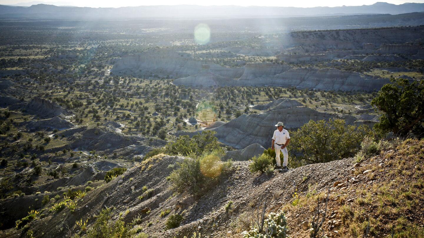 Scott Richardson, a paleontologist's technician, stands on a ridge in Utah's Grand Staircase-Escalante Monument on May 29, overlooking a valley he describes as "dinosaur country."