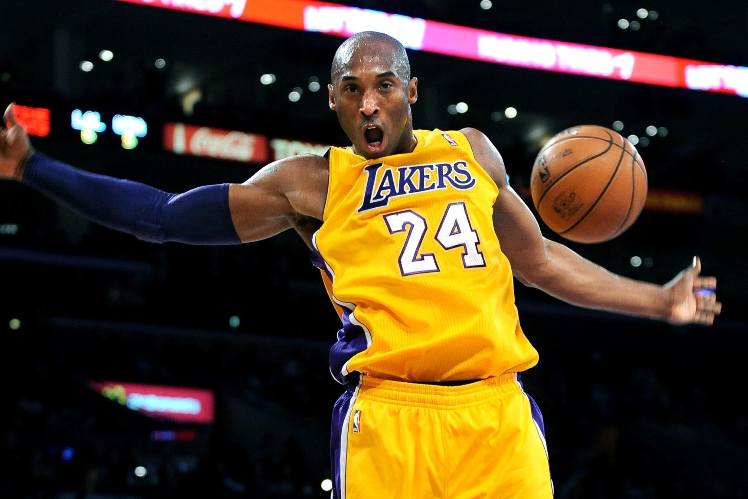 Kobe Bryant dunks during a game in 2012.