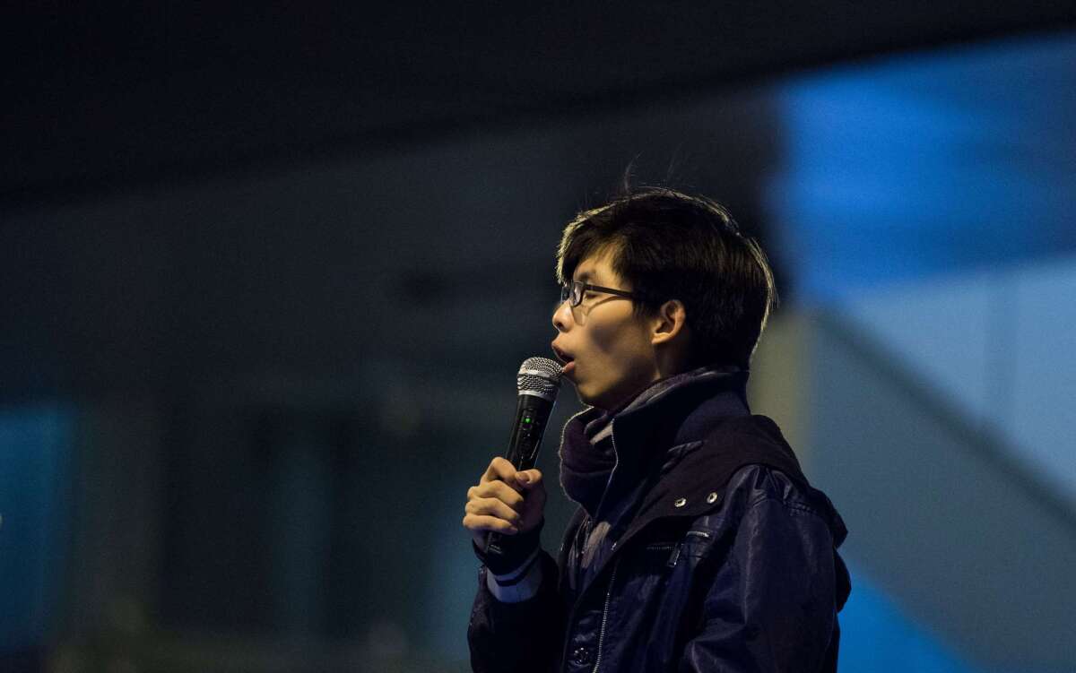 Joshua Wong addresses protestors at the movement's main protest site in the Admiralty district of Hong Kong on Saturday after ending a four-day hunger strike.