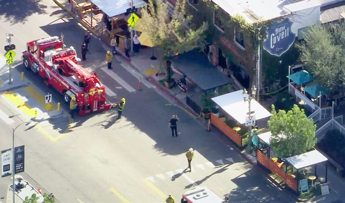 First responders at the scene, where a car slammed through the outdoor dining area of a Los Feliz restaurant