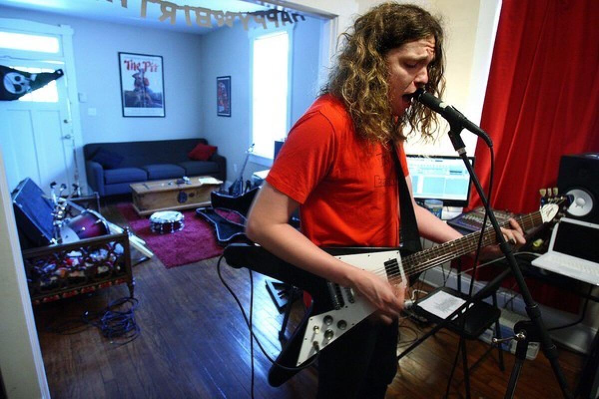 Punk rocker Jay Reatard, seen in May rehearsing in his Memphis home, started recording songs in his bedroom as a teenager and was playing Memphis clubs by age 15.