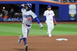 NEW YORK, NEW YORK - OCTOBER 17: Mookie Betts #50 of the Los Angeles Dodgers celebrates while.