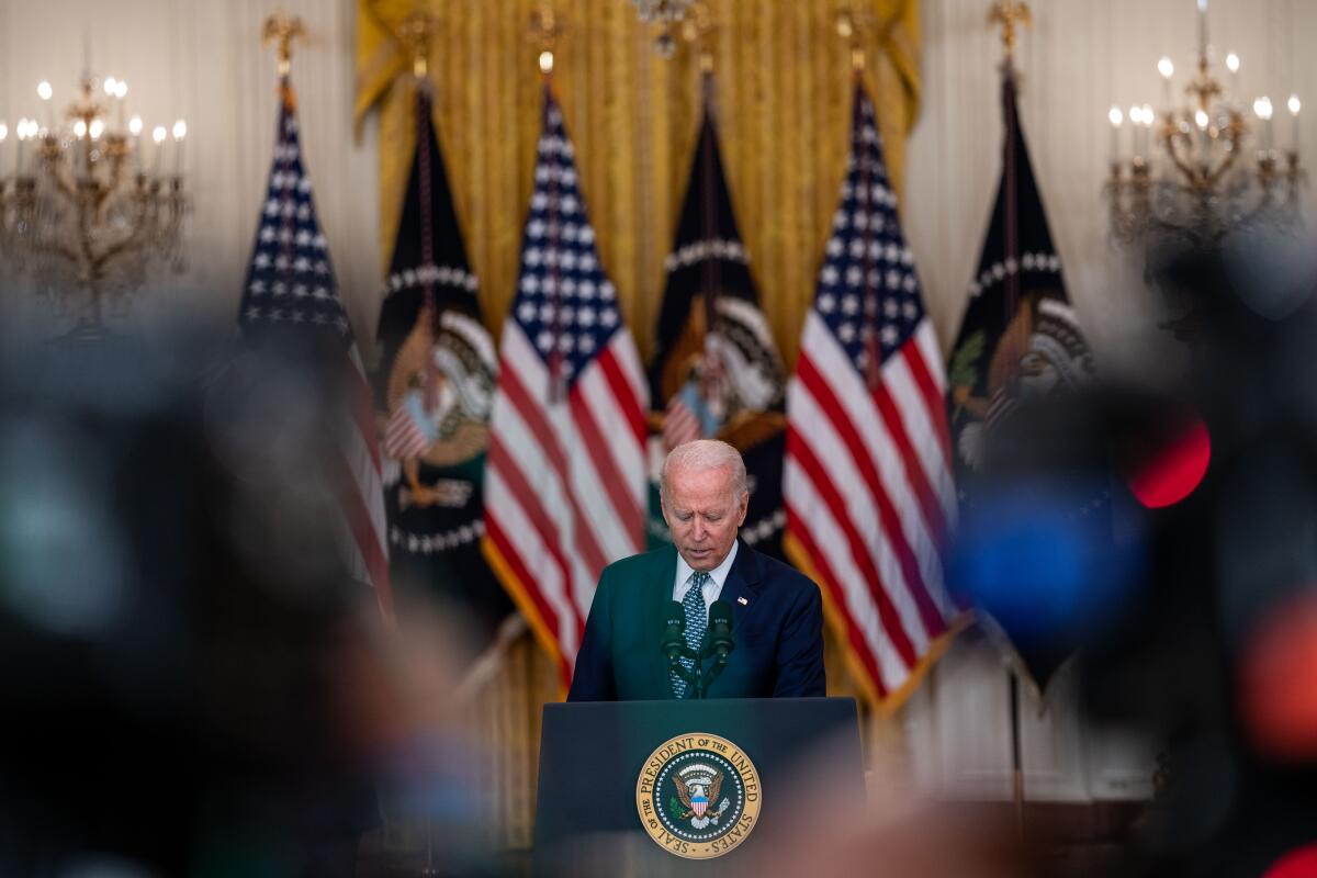 President Biden speaks at a lectern