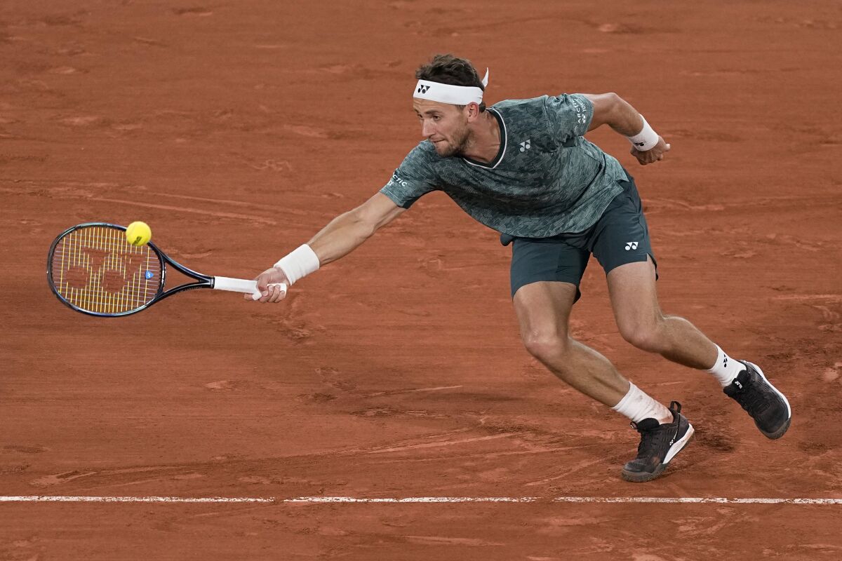 Norway's Casper Ruud plays a shot against Denmark's Holger Rune during their quarterfinal match at the French Open tennis tournament in Roland Garros stadium in Paris, France, Wednesday, June 1, 2022. (AP Photo/Michel Euler)
