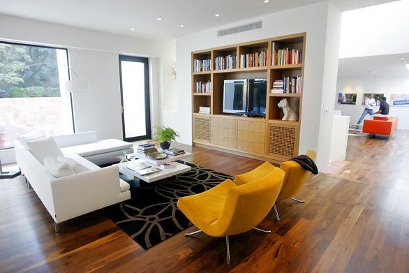 The living room, left, and the den, right.