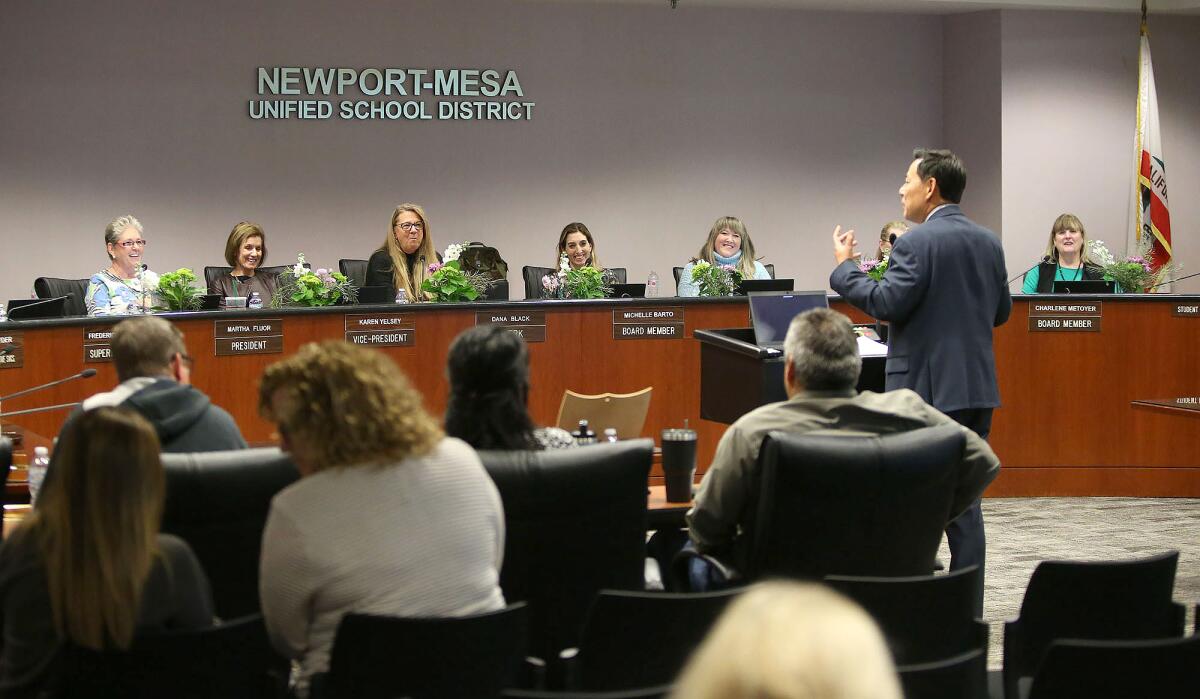 Russell Lee-Sung, deputy superintendent of the Newport-Mesa Unified School District, addresses the board about coronavirus protocols during a meeting Wednesday.