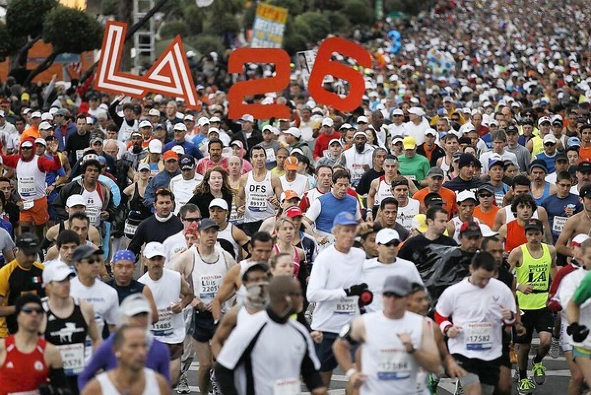 The L.A. Marathon begins at Dodger Stadium on Sunday. The route will end at the Santa Monica Pier. Last year's race, shown here at its start, drew thousands of runners.