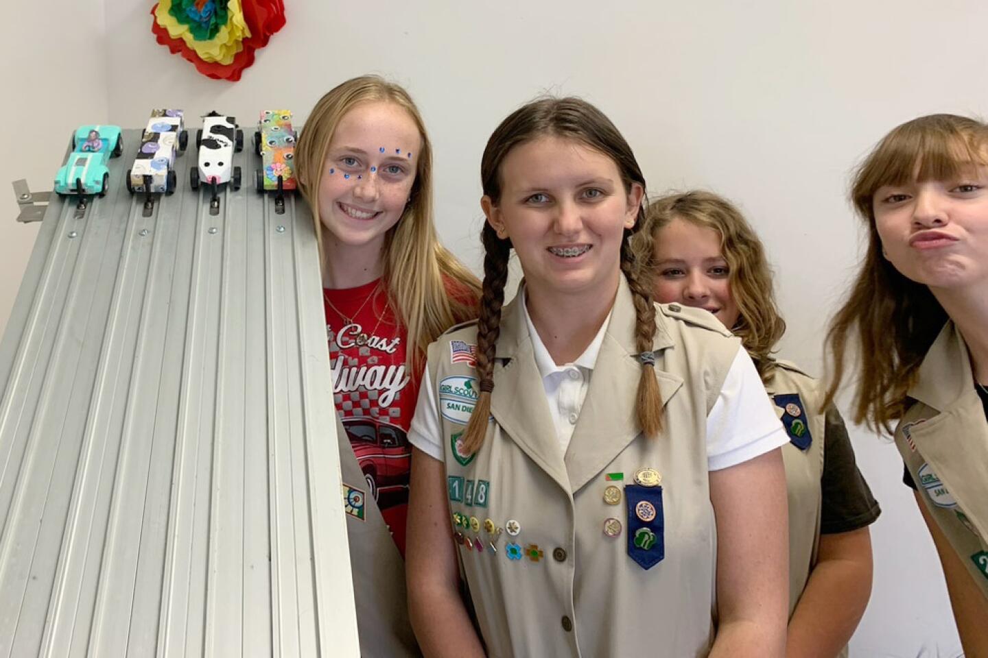 Girls at Pinewood Derby: The new face of Boy Scouting