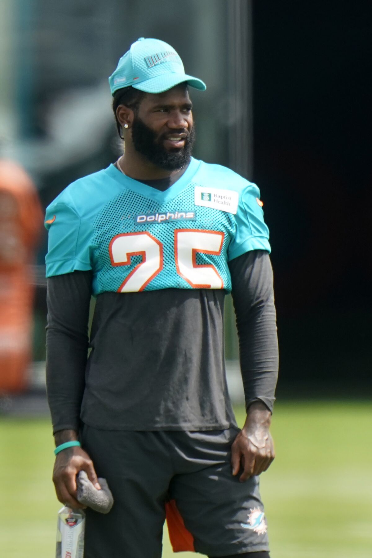 Miami Dolphins cornerback Xavien Howard watches during practice at the NFL football team's training facility, Wednesday, Aug. 4, 2021, in Miami Gardens, Fla. (AP Photo/Wilfredo Lee)