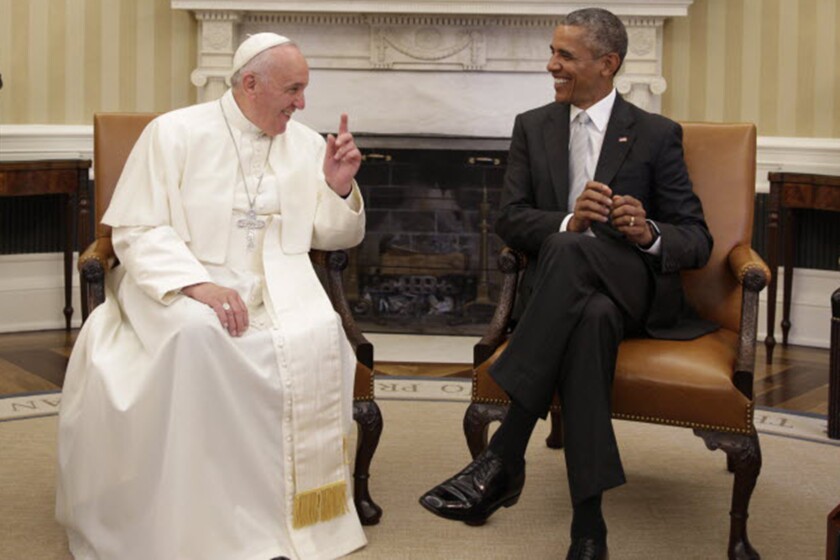 Pope Francis, left, and President Barack Obama seated in the White House.