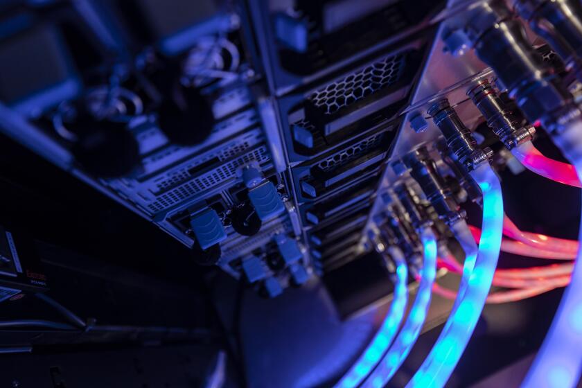 Cables connected to the back of a server. Photographer: Qilai Shen/Bloomberg