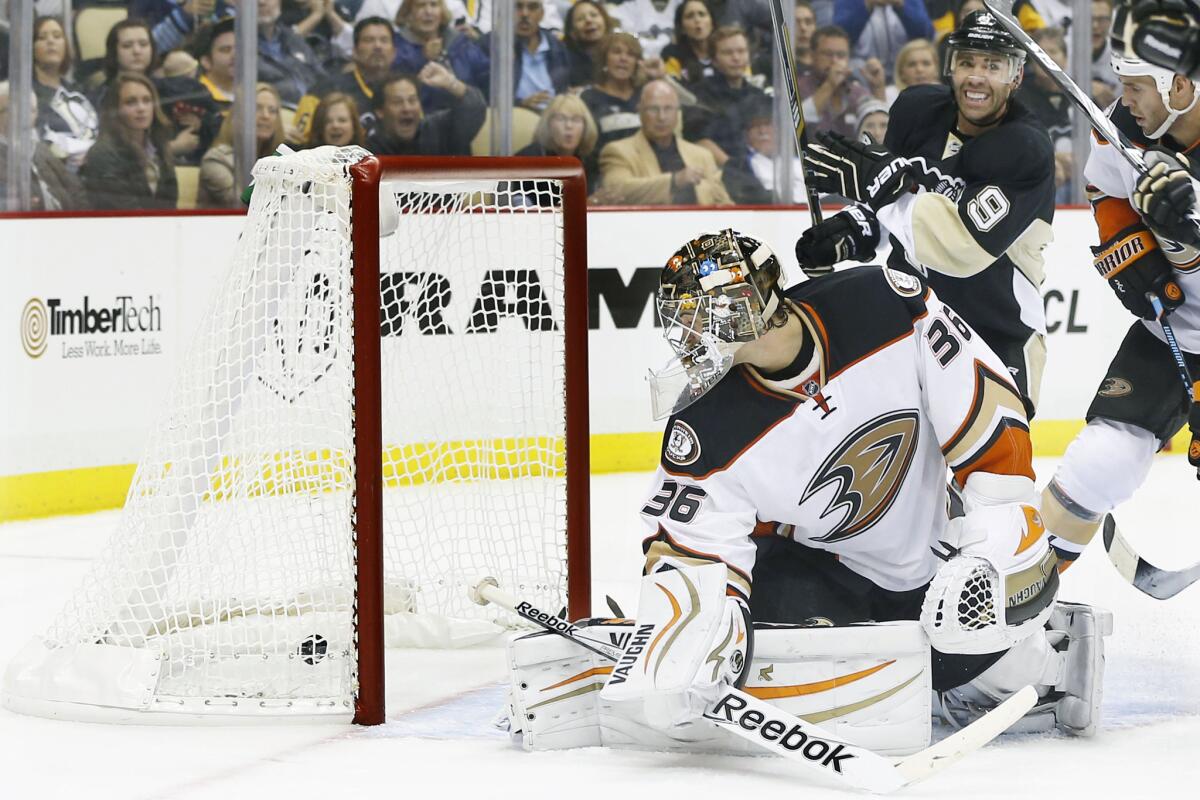 Ducks goalie John Gibson looks back at the puck on a goal by Pittsburgh's Sidney Crosby on Oct. 9.