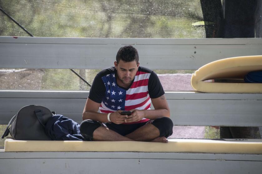 A man rests at a shelter where a group of 300 Cubans remain, in La Cruz, Costa Rica, near the border with Nicaragua on Thursday. Many Cuban migrants heading to the U.S. begin their journey by flying to Ecuador.