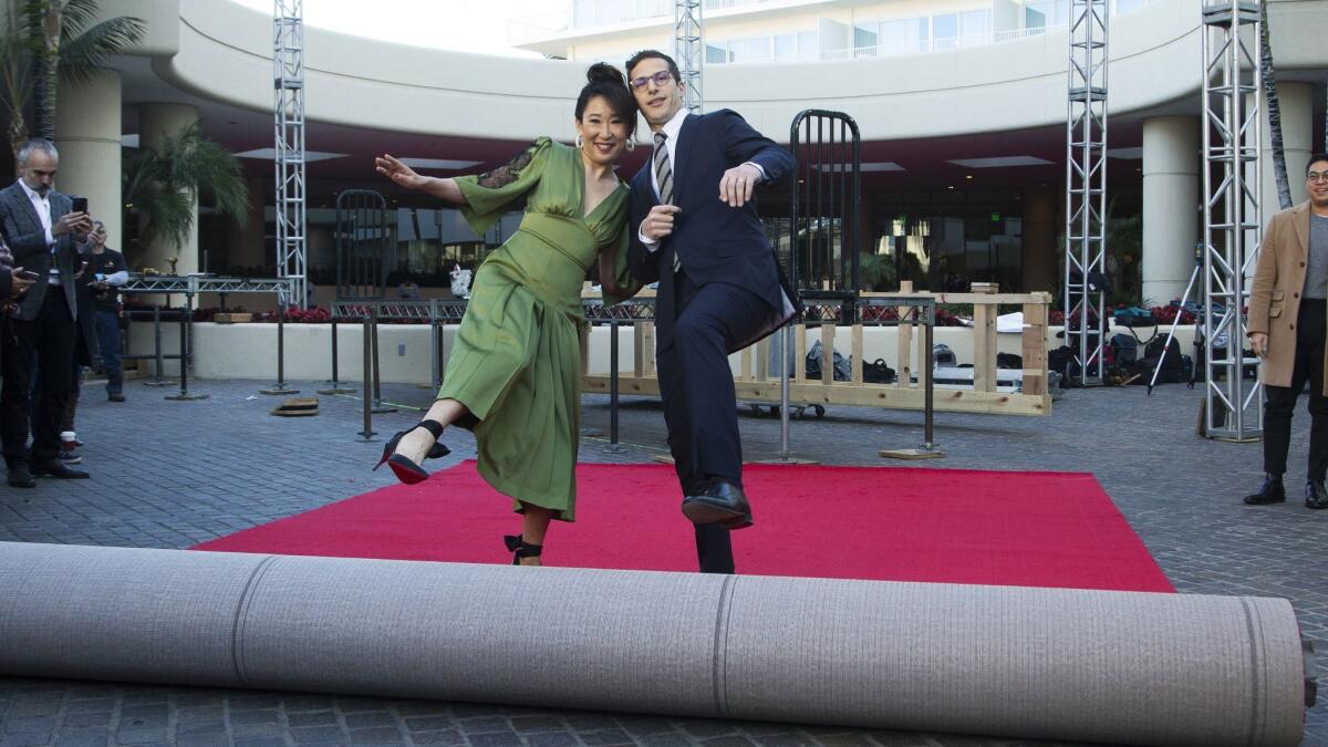Sandra Oh, left, and Andy Samberg roll out the red carpet at the 76th Golden Globe Awards preview day at the Beverly Hilton on Thursday.