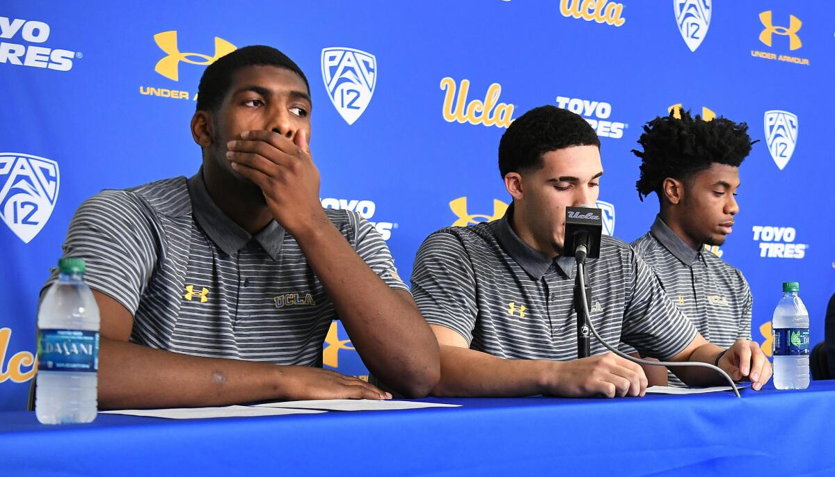UCLA basketball players, from left, Cody Riley, LiAngelo Ball and Jalen Hill give statements at Pauley Pavilion about their arrests in China during a press conference Wednesday.