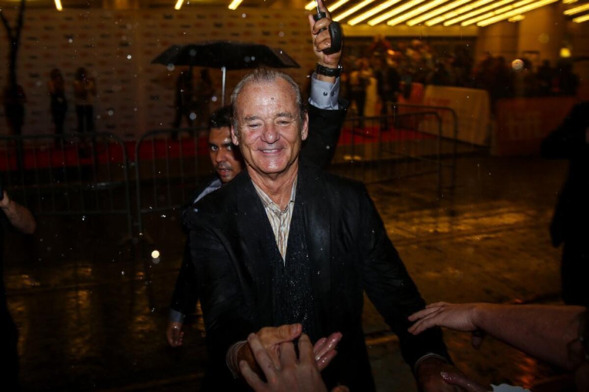 Yes, it was raining just a bit when Bill Murray arrived for the Toronto premiere of his new movie, "St. Vincent."