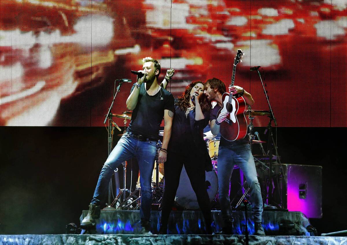 Lady Antebellum members Charles Kelley, left, Hillary Scott and Dave Haywood perform at the Stagecoach festival.