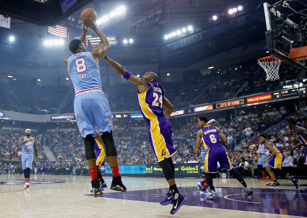 Sacramento's Rudy Gay shoots over Lakers' Kobe Bryant at Sleep Train Arena on Oct. 30.