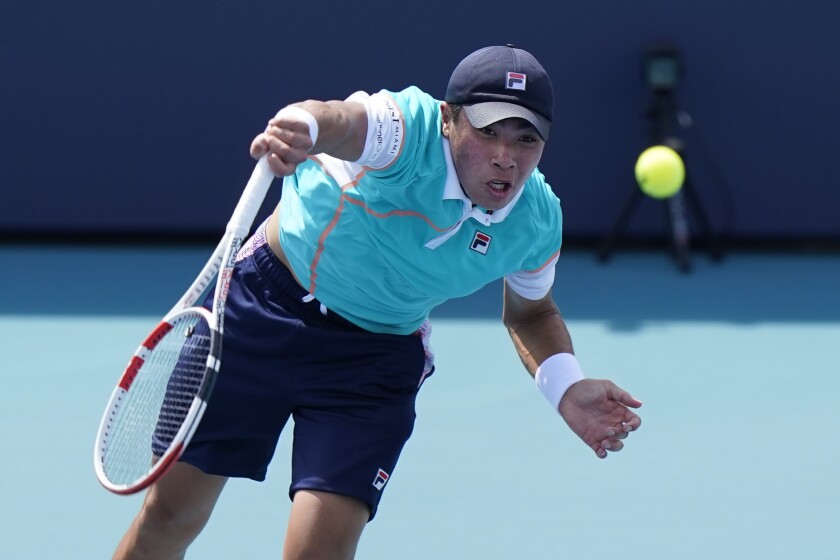 Brandon Nakashima serves to Kwon Soon-woo during the Miami Open in March.