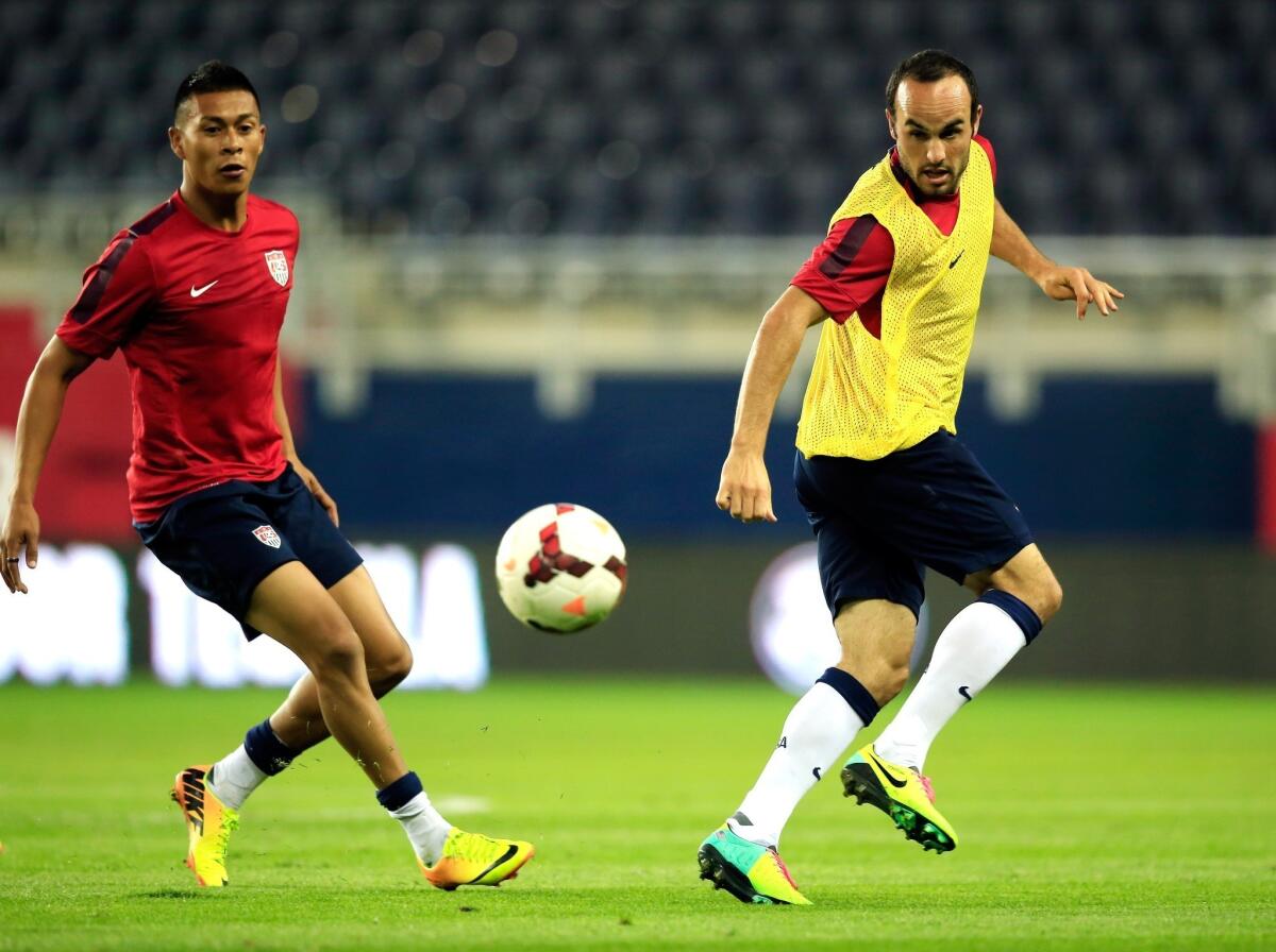 Michael Orozco Fiscal and Landon Donovan scrimmage during a U.S. men's national team practice at Sporting Park in Kansas on Thursday.