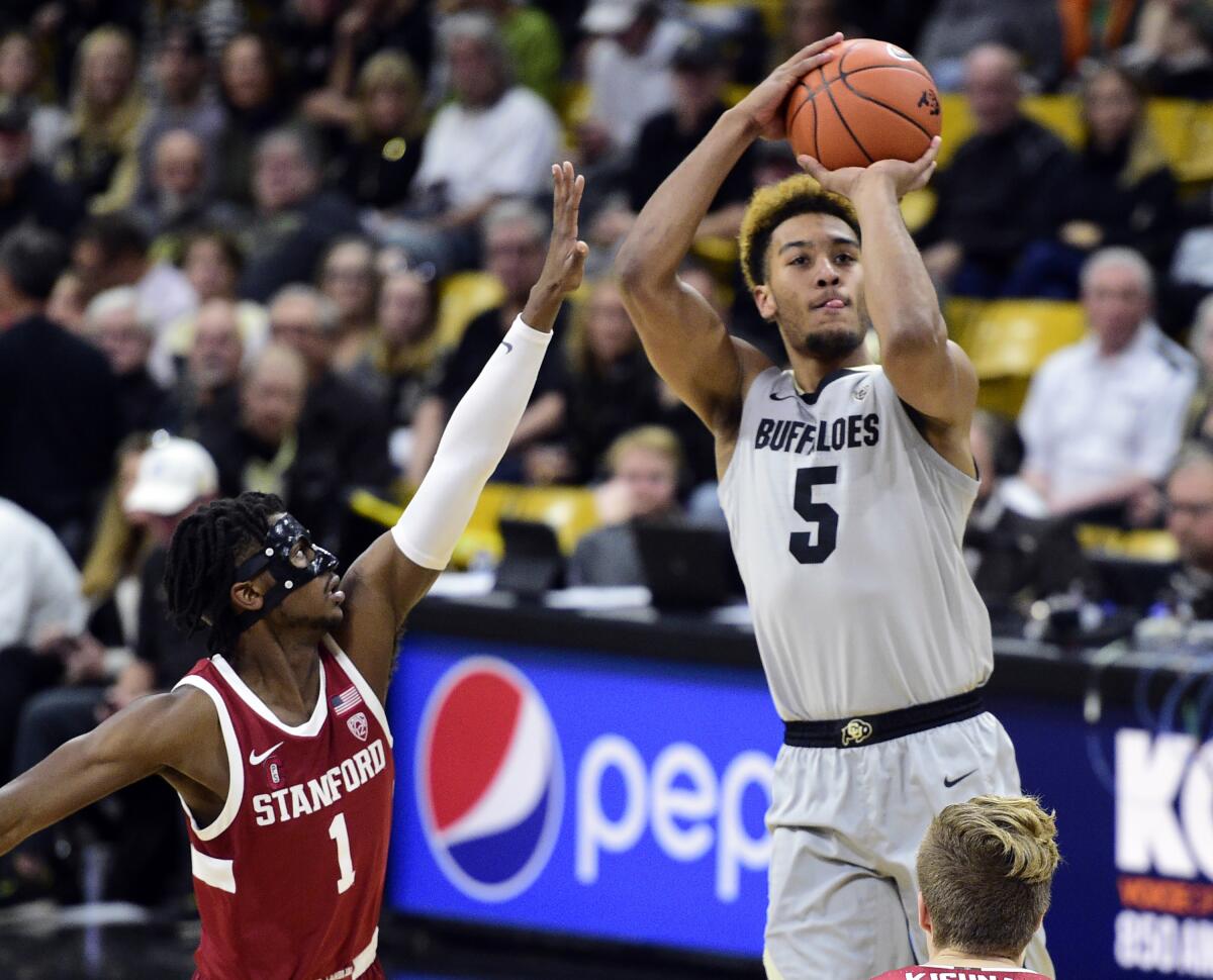 Colorado's D'Shawn Schwartz goes up for a second-half shot over Stanford's Daejon Davis on Feb. 8, 2020.