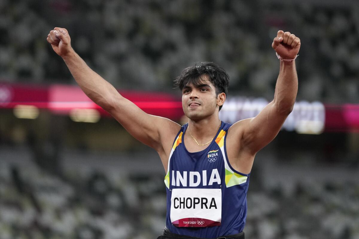 Neeraj Chopra, of India, celebrates after winning the gold medal in the men's javelin throw final at the 2020 Summer Olympics, Saturday, Aug. 7, 2021, in Tokyo. (AP Photo/Matthias Schrader)