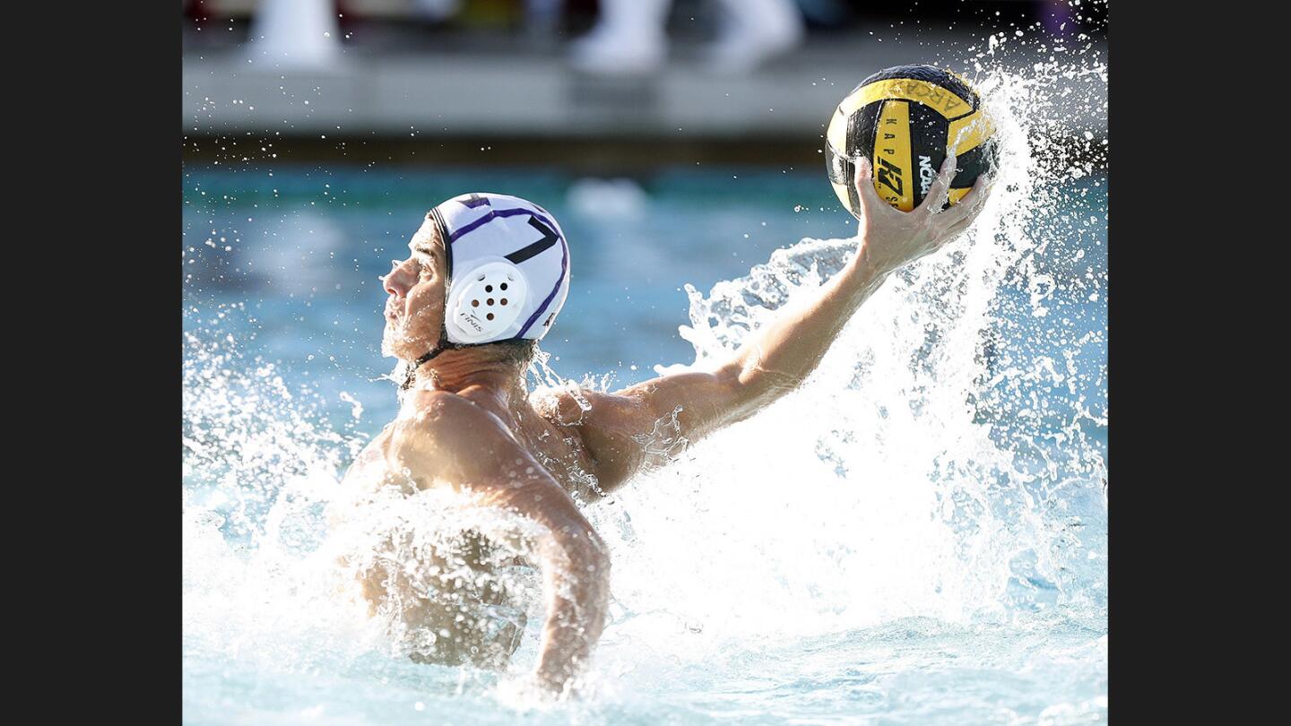 Hoover's David Ashkharian receives a pass in front of the goal and shoots and scores against Crescenta Valley in the Pacific League boys' water polo semifinals at Arcadia High School on Tuesday, October 24, 2017.