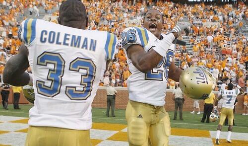 UCLA's Derrick Coleman and Andrew Abbott celebrate a 19-15 victory over Tennessee on Saturday.